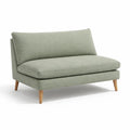 Divano a due posti in tessuto verde con gambe in legno