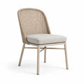 Sedia in rattan con struttura in metallo e cuscino in tessuto